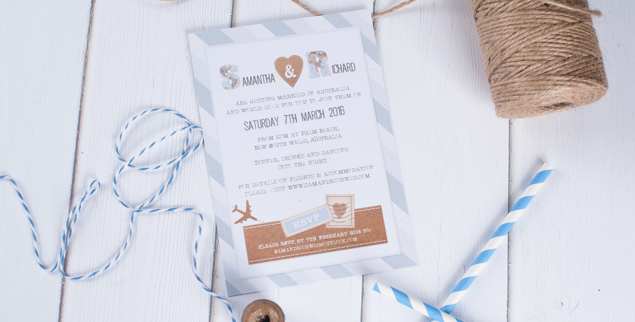 A travel inspired wedding invitation with postal staps and brown recycled paper